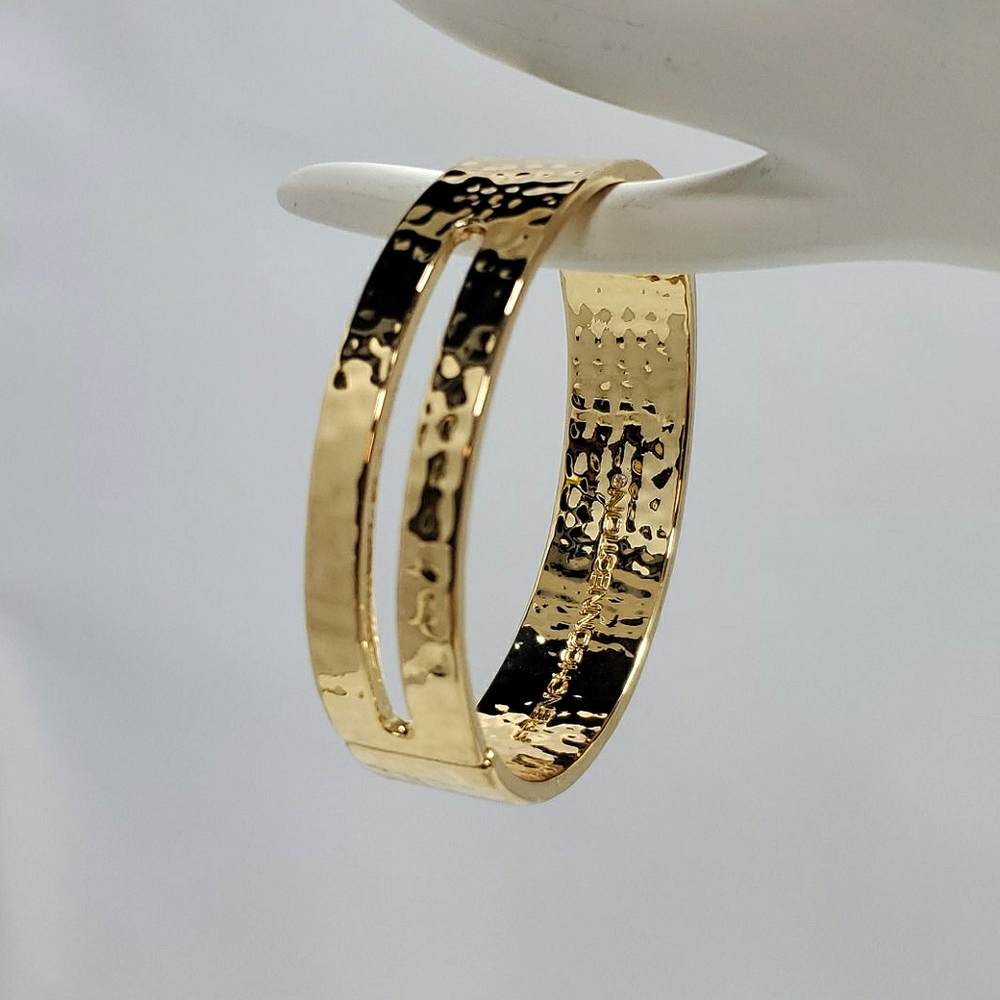 French connection gold hammered hinged bracelet